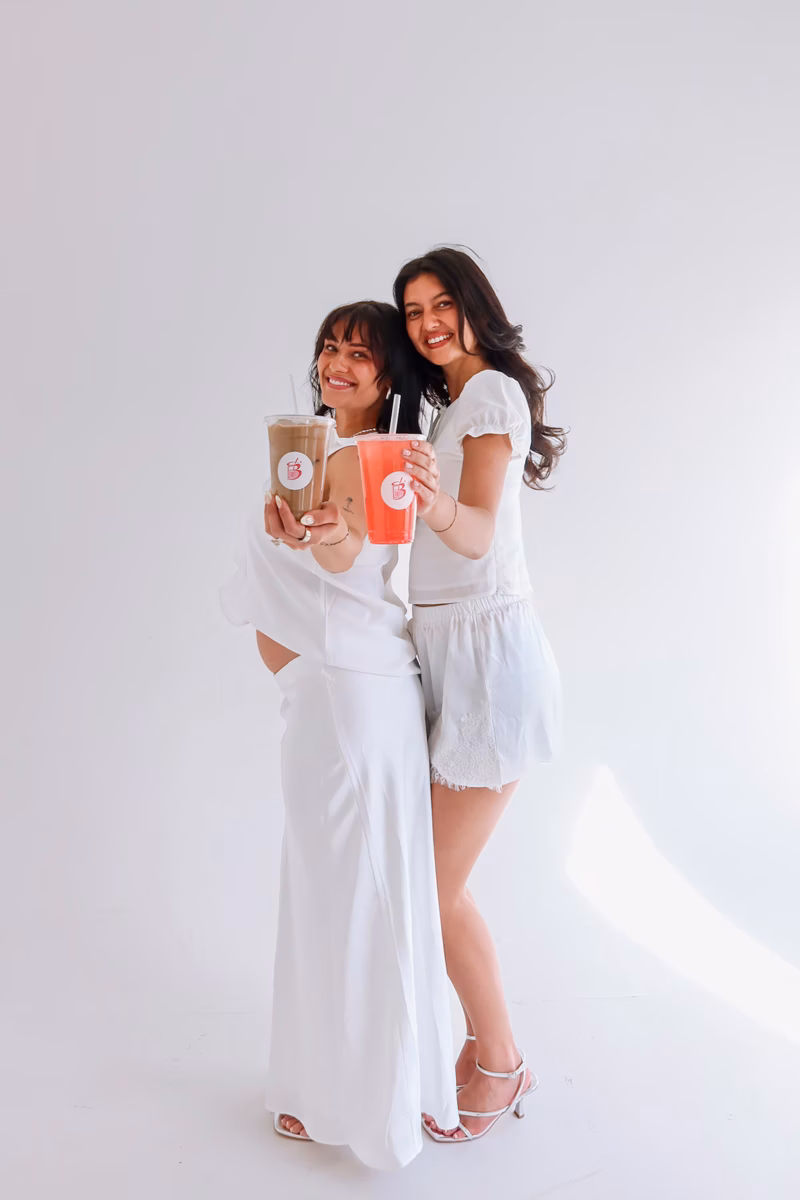 Kennen and Zoe, founders of The Bev, holding signature drinks